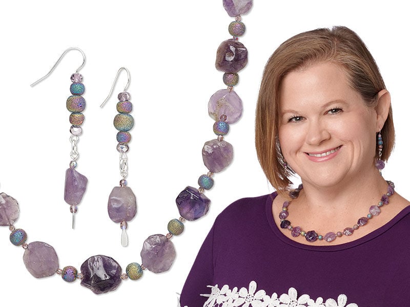 Model wearing a necklace and earrings with amethyst gemstones