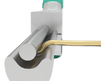 Looping pliers closed over wire