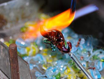 Adding colored glass to heated piece