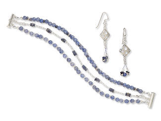 An image of a multi strand bracelet and earrings that are made with iolite beads