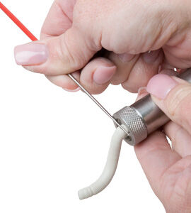Clay tube being cut out of Clay extruder