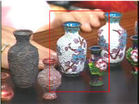 Filled in designs on vases