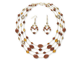 An image of a multi strand necklace and earrings that uses goldstone and glass beads