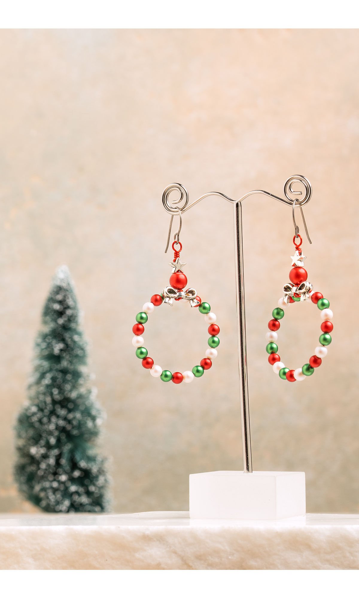Christmas earrings displayed on wire display
