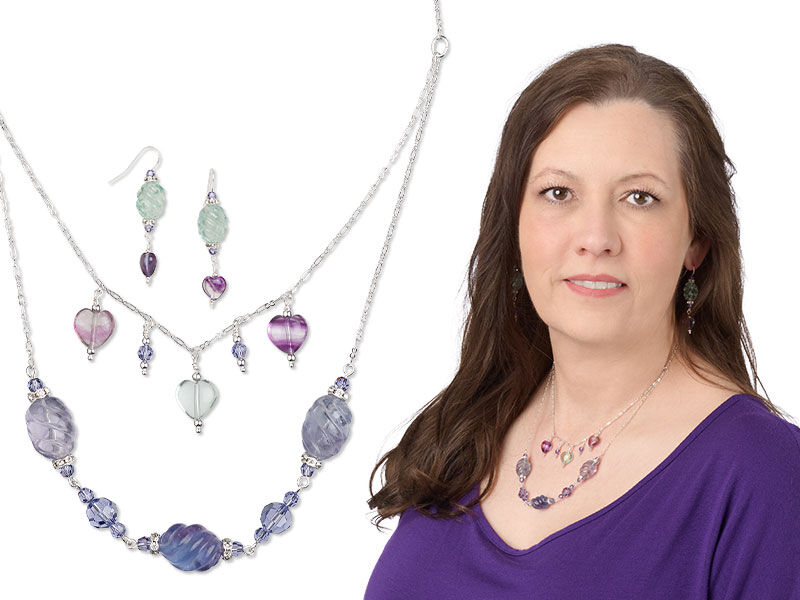 Model wearing a necklace and earrings that uses head pins