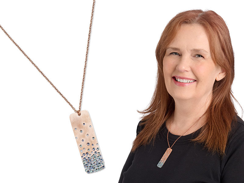 Model wearing a necklace made with rhinestones