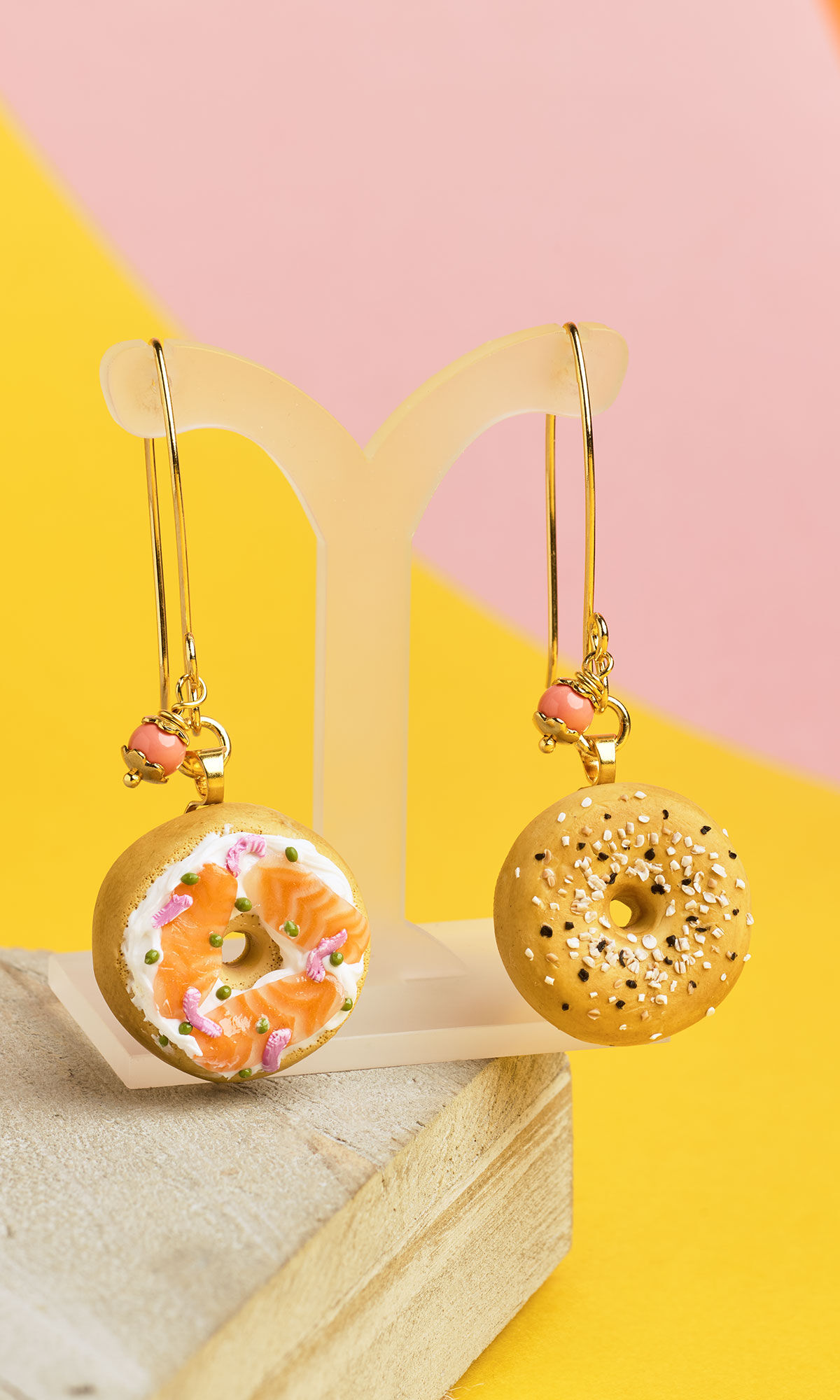Design Idea RA26 on an earrings display surrounded by yellow and pink