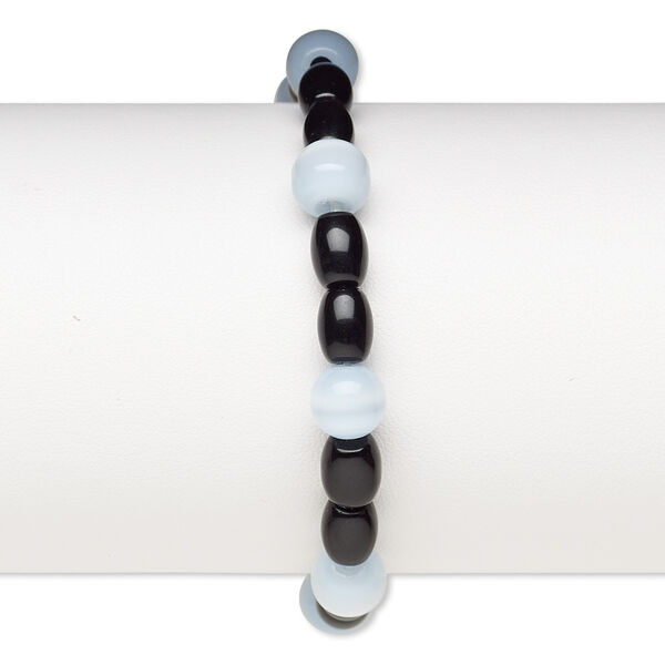 Bracelet, stretch, glass and cat's eye glass, opaque blue-violet and black, 7-8mm round and 7x5mm-8x6mm barrel, 6-1/2 inches. Sold individually. image number 0