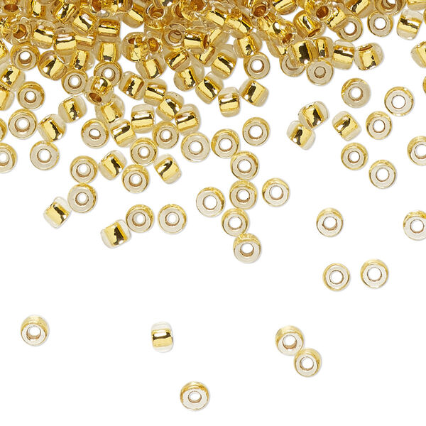 Seed bead, TOHO BEADS®, glass, pkg/50g, #8 round, transparent 24Kt gold-lined crystal clear (TR-08-701). image number 0