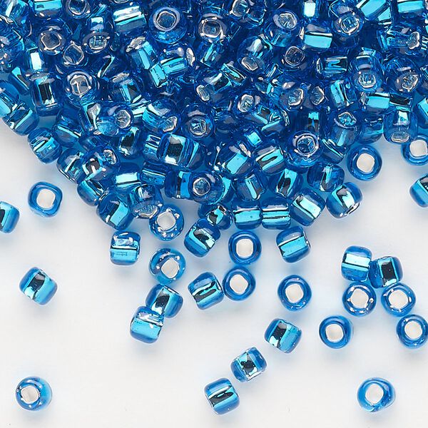 Seed bead, Dyna-Mites™, glass, silver-lined translucent turquoise blue, #6 round with square hole. Sold per 1/2 kilogram pkg. image number 0