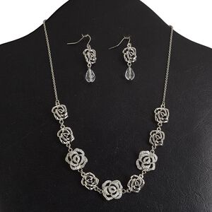 Necklace and earring set, epoxy / acrylic / rhodium-finished "pewter" (zinc-based alloy), white and clear with glitter, 17x17mm and 14x13mm rose, 18 inches with 3-inch extender chain and lobster claw clasp, 1-5/8 inch earrings with fishhook ear wire. Sold per set.