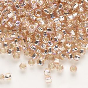 Seed bead, Dyna-Mites™, glass, silver-lined translucent rainbow light pink, #6 round with square hole. Sold per 40-gram pkg.