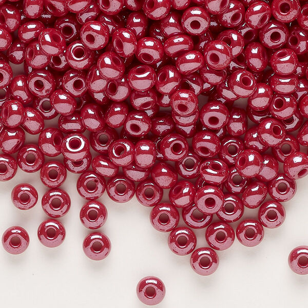 Seed bead, glass, pkg/50g, #6 rocaille, opaque luster dark red. image number 0