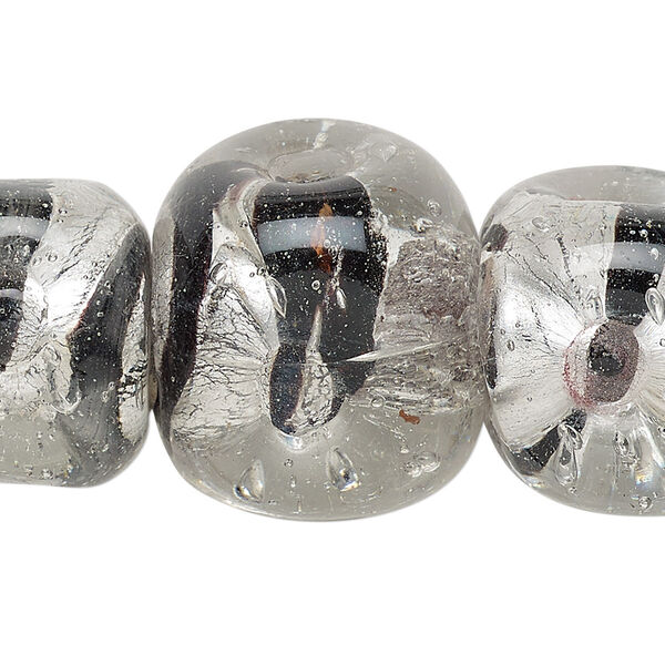 Bead, lampworked glass, transparent clear / black / dark purple with silver-colored foil, 18-26mm dimpled uneven cube with stripes, 6-8mm hole. Sold per 15-inch strand. image number 0