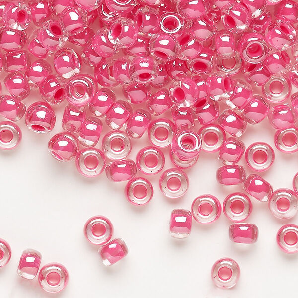 Seed bead, Miyuki, glass, pkg/25g, #6 rocaille, translucent carnation pink-lined luster crystal clear (RR-208). image number 0