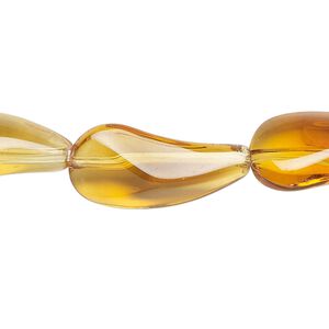 Bead, glass, transparent light honey, 24x12mm paisley. Sold per 14-inch strand, approximately 10 beads.