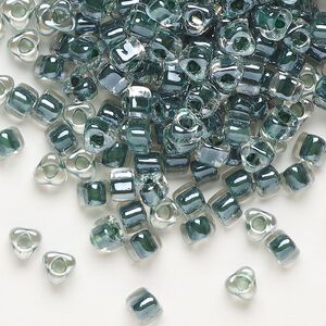 Seed bead, Miyuki, glass, transparent clear color-lined steel blue, (TR1127), #5 triangle. Sold per 25-gram pkg.