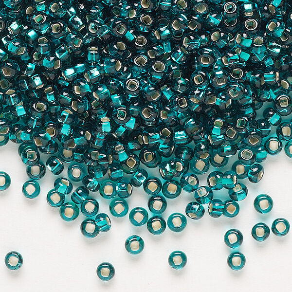 Seed bead, Preciosa Ornela Czech glass, pkg/50g, #8 rocaille, transparent silver-lined teal, (57710). image number 0