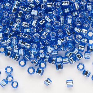 Seed bead, Dyna-Mites™, glass, silver-lined translucent blue, #6 round with square hole. Sold per 1/2 kilogram pkg.