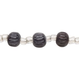 Bead, wood and glass, black and clear, 8x6mm-9x8mm corrugated rondelle with seed bead spacers. Sold per 12-inch strand, approximately 25 beads.