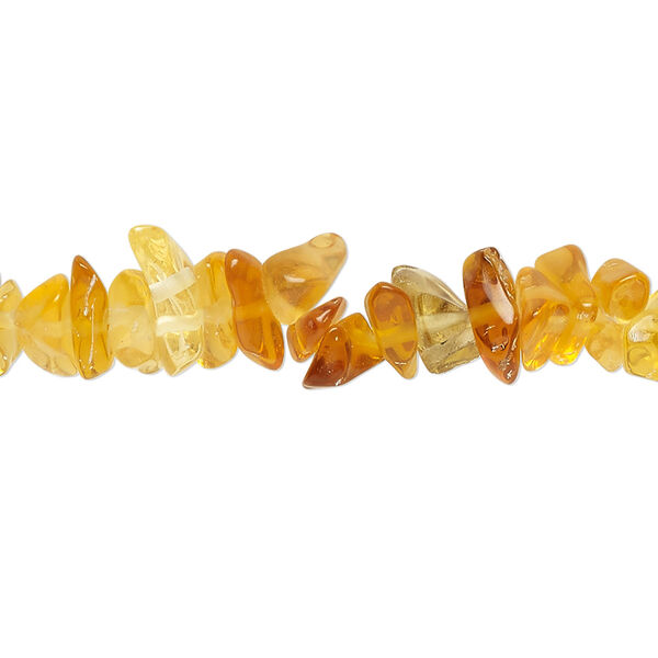 Bead, glass, translucent golden amber, small to extra-large chip. Sold per 30-inch strand. image number 0