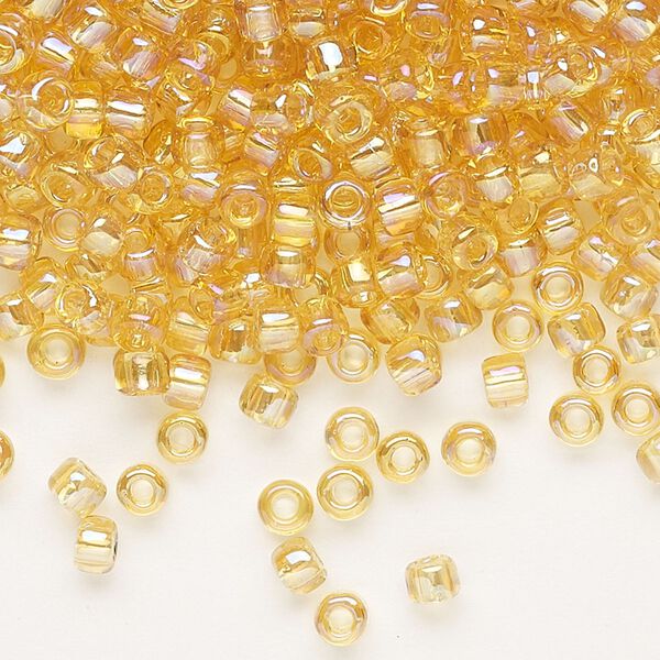 Seed bead, Dyna-Mites™, glass, transparent rainbow amber yellow, #6 round. Sold per 40-gram pkg. image number 0