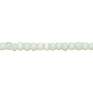 Bead, cat's eye glass (fiber optic glass), sea green, 3x2mm-4x3mm uneven round. Sold per 14-inch strand, approximately 140 beads.