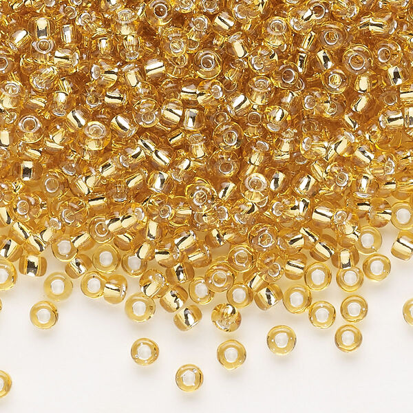 Seed bead, Dyna-Mites™, glass, silver-lined translucent medium gold, #8 round. Sold per 40-gram pkg. image number 0