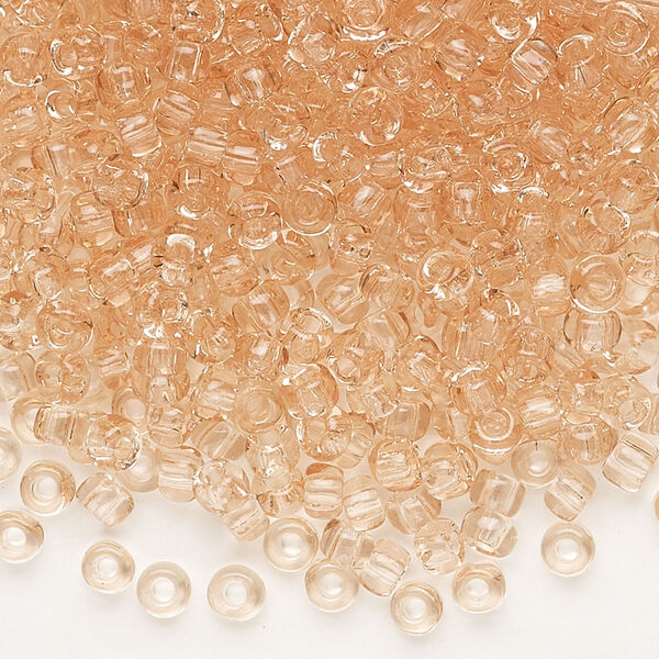 Seed bead, Dyna-Mites™, glass, transparent light peach, #6 round. Sold per 40-gram pkg. image number 0