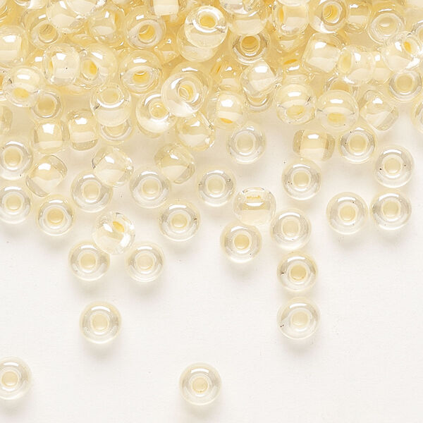 Seed bead, Miyuki, glass, pkg/25g, #6 rocaille, translucent ivory-lined luster crystal clear (RR-2215). image number 0