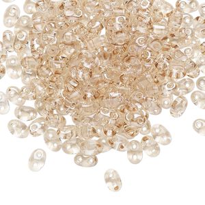 Seed bead, Preciosa Twin™ Czech glass, pkg/250g, 5x2.5mm oval, transparent honey crystal clear, (20201).