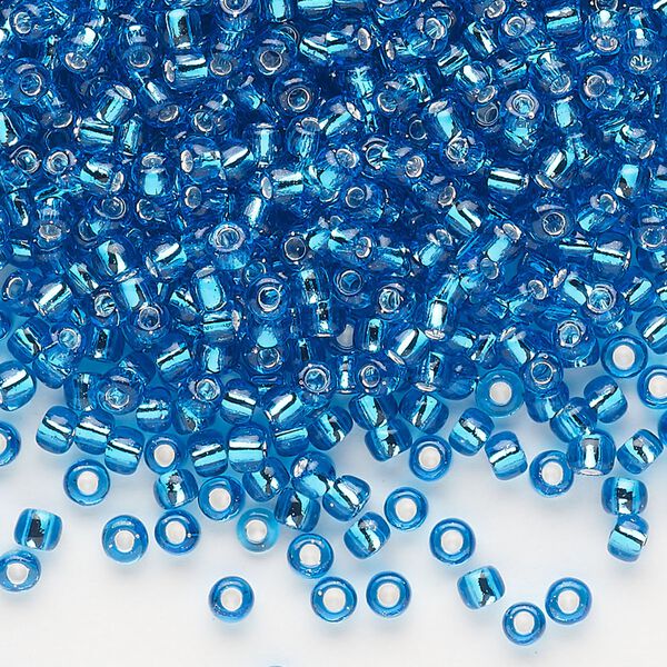 Seed bead, Dyna-Mites™, glass, silver-lined translucent turquoise blue, #8 round. Sold per 40-gram pkg. image number 0