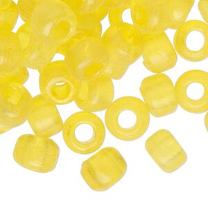 Bead, glass, transparent yellow, 9x7mm crow. Sold per pkg of 100.