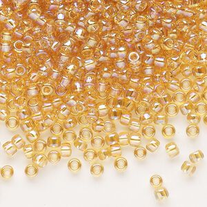 Seed bead, Dyna-Mites™, glass, transparent rainbow amber yellow, #8 round. Sold per 1/2 kilogram pkg.