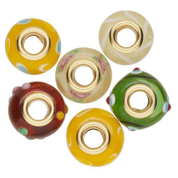 Bead, Dione®, lampworked glass and gold-finished brass grommets, transparent yellow and opaque multicolored, 12x8mm-16x9mm rondelle with assorted designs. Sold per pkg of 6. image number 0