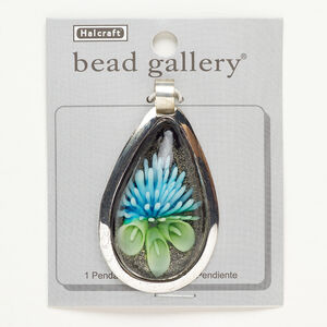 Pendant, silver-finished brass and lampworked glass, black / blue / green, 57x37mm teardrop with flower and green-colored foil. Sold individually.