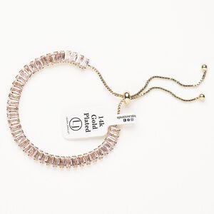 Bracelet, adjustable, brass / glass / silicone, pkg/1, 6 to 10 inches, gold plate and pink tourmaline.