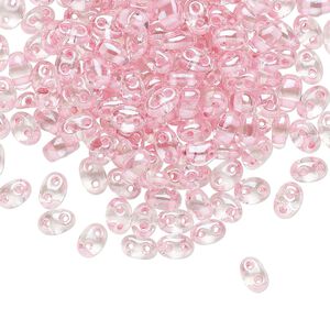 Seed bead, Preciosa Twin™ Czech glass, pkg/250g, 5x2.5mm oval, transparent pink terra color-lined clear, (38694).