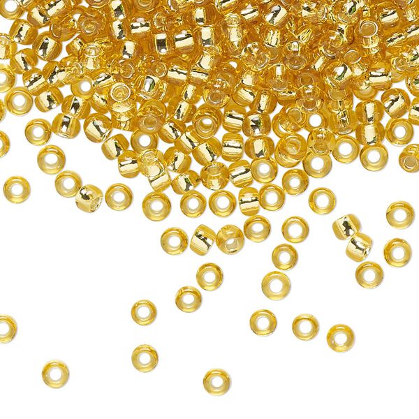 Seed bead, TOHO BEADS®, glass, pkg/7.5g, #8 round, transparent silver-lined light topaz (TR-08-22). image number 0
