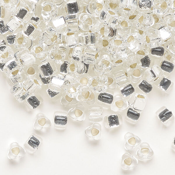 Seed bead, Miyuki, glass, silver-lined translucent clear, (TR1101), #5 triangle. Sold per 25-gram pkg. image number 0