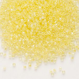 Seed bead, Delica®, glass, pkg/250g, #11 round, translucent light yellow-lined rainbow crystal clear (DB-0053).