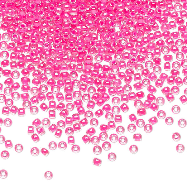 Seed bead, TOHO BEADS®, glass, pkg/7.5g, #11 round, translucent luminous inside color neon pink (TR-11-978). image number 0
