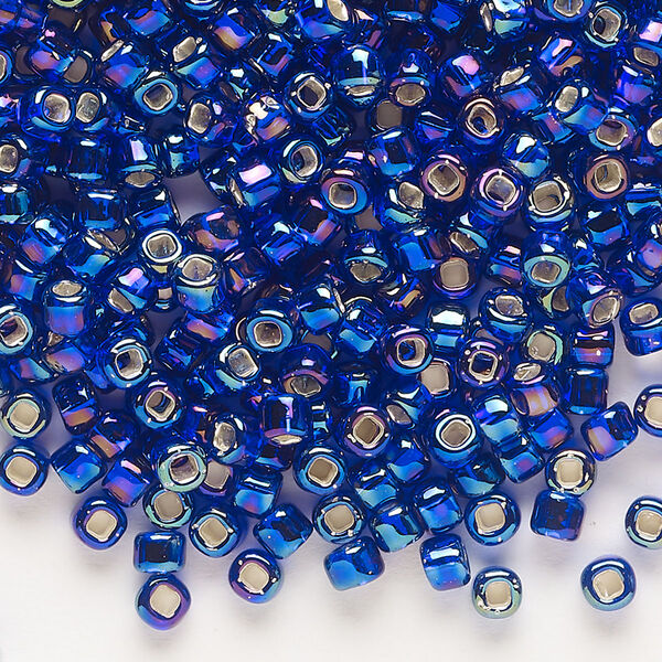 Seed bead, Dyna-Mites™, glass, silver-lined translucent rainbow cobalt, #6 round with square hole. Sold per 40-gram pkg. image number 0