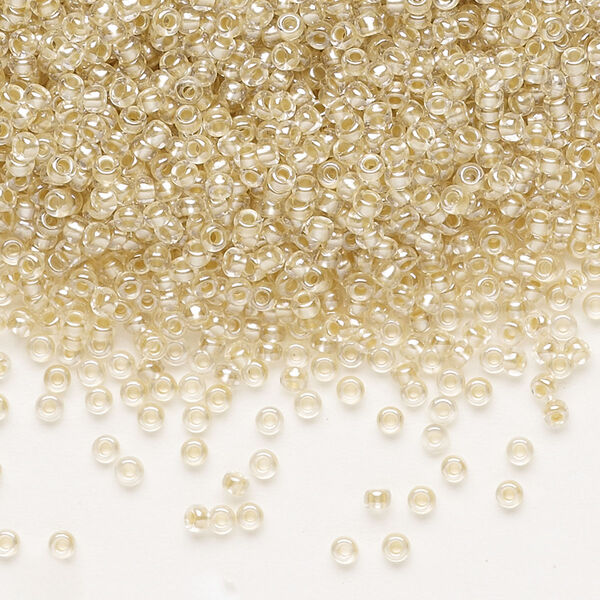 Seed bead, Preciosa Ornela, glass, translucent mocca pearl-lined crystal clear, #11 rocaille. Sold per 50-gram pkg. image number 0