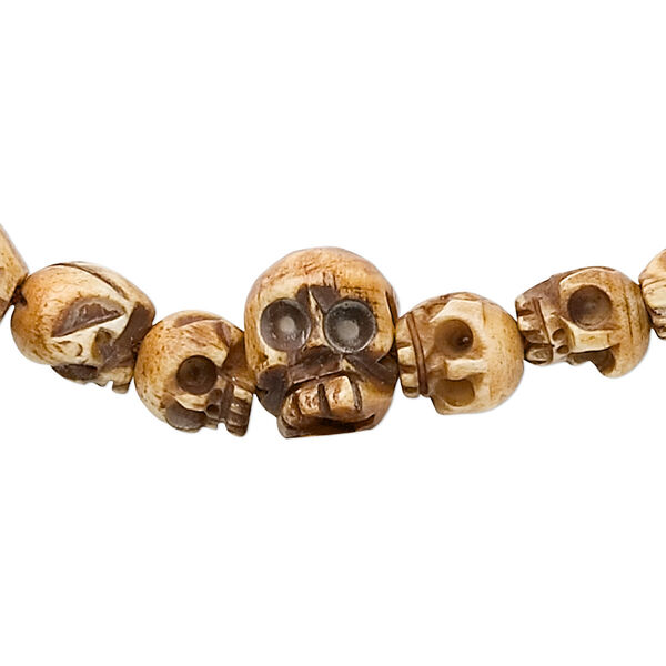 Bead, bone (dyed), antiqued, hand-carved skull, Mohs hardness 2-1/2. Sold per 42-inch strand, approximately 108 beads. image number 0
