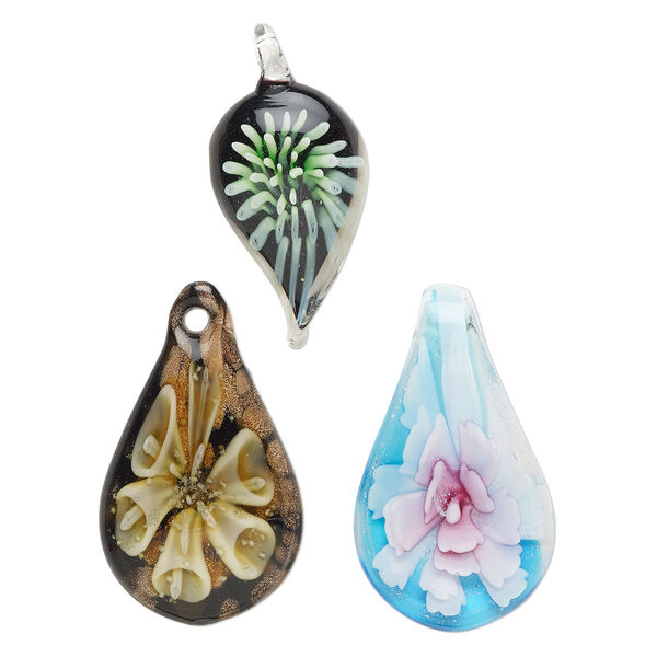 Random focal mix, lampworked glass, pkg/3,  38x17mm-60x31mm mixed shapes with flower, opaque and translucent mixed colors with silver-colored foil and copper-colored glitter. image number 0