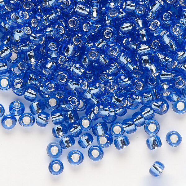 Seed bead, Dyna-Mites™, glass, transparent silver-lined light blue, #6 round. Sold per 1/2 kilogram pkg. image number 0