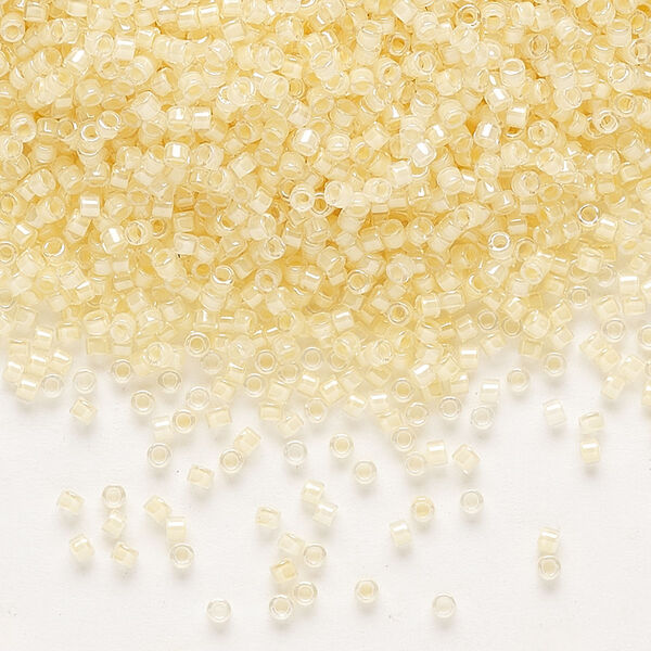 Seed bead, Delica®, glass, pkg/250g, #11 round, translucent ivory-lined luster crystal clear (DB-2371). image number 0