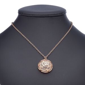 Necklace, glass rhinestone with copper-finished steel and "pewter" (zinc-based alloy), clear, 30.5mm domed round with flower cutout design, 18 inches with 2-inch extender chain and lobster claw clasp. Sold individually.