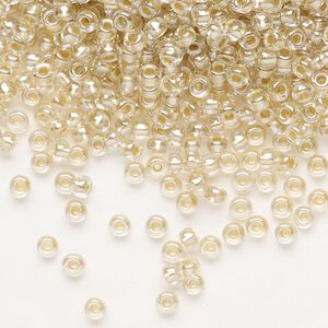 Seed bead, Preciosa Ornela, glass, translucent mocca pearl-lined crystal clear, #8 rocaille. Sold per 50-gram pkg.